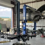 Drive Line Service inspection with vehicle on lift showing drivetrain and driveshaft components